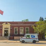 Borough hall in downtown north east with a postal truck out front of it