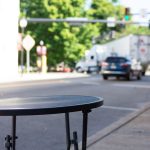 empty table outside of a business downtown in North East