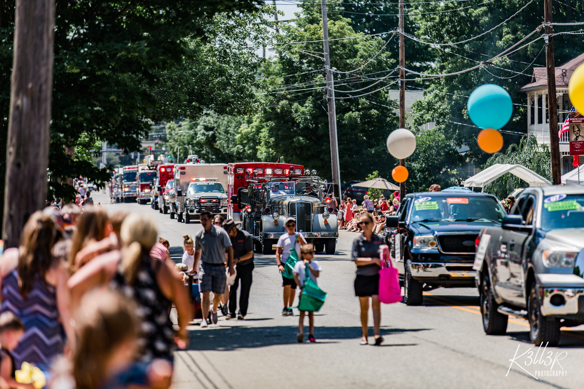 People walking down the street for a parade