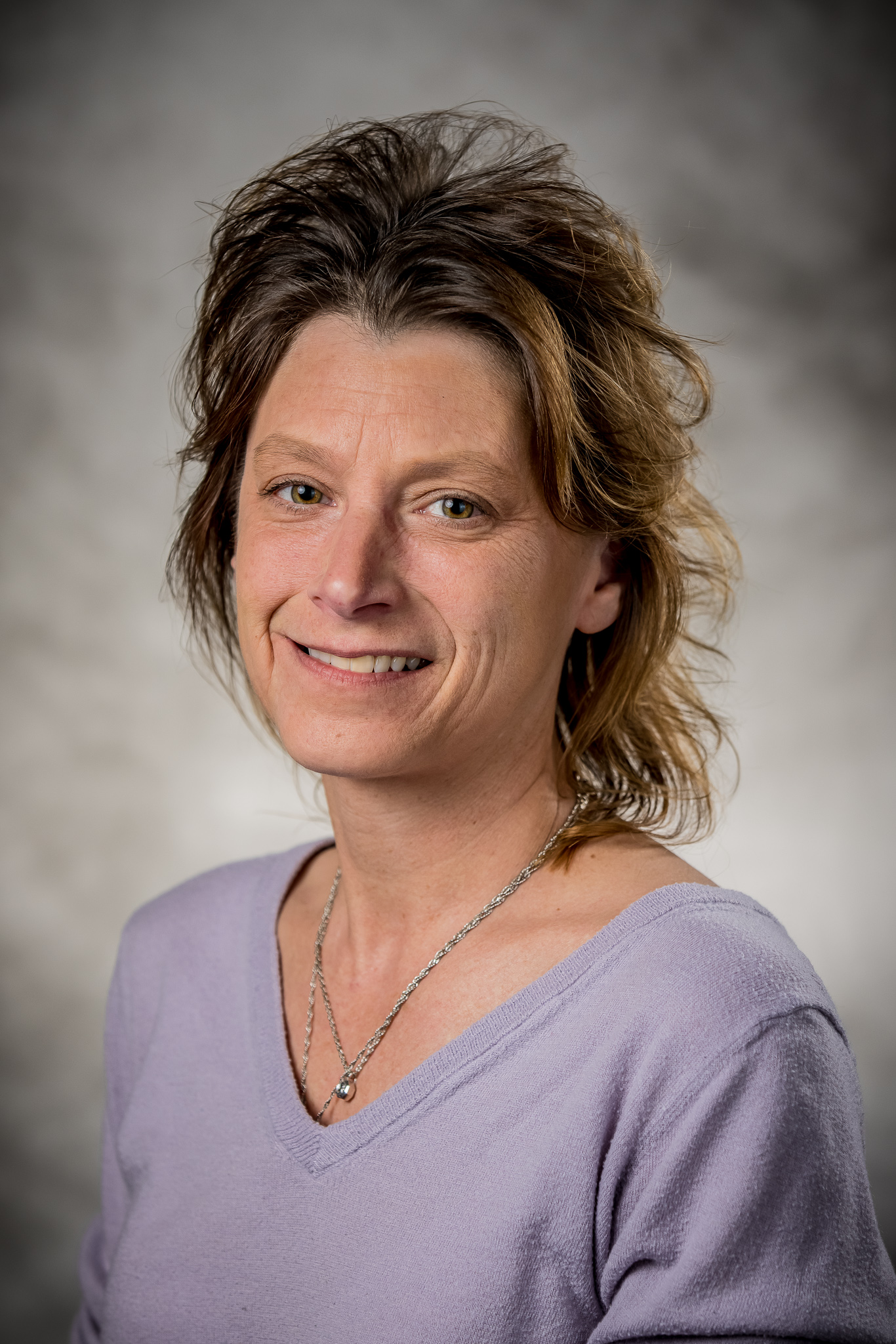 woman wearing light purple shirt